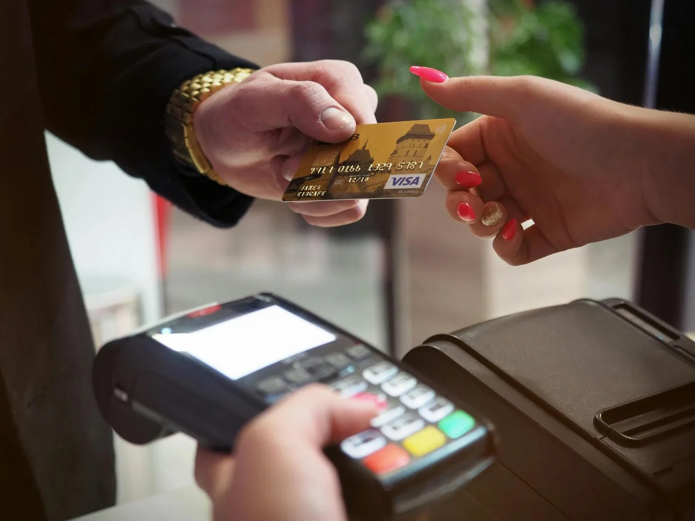 A credit card being tapped on a payment terminal